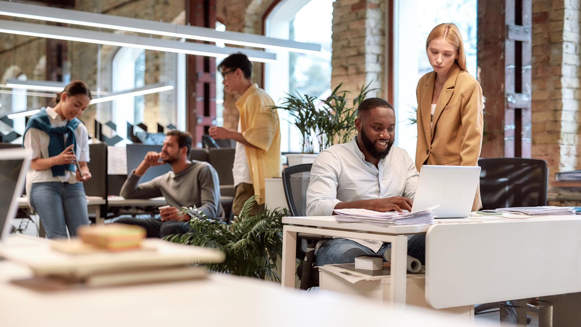 Young professionals. Group of multiracial business people working together in the creative co-working space